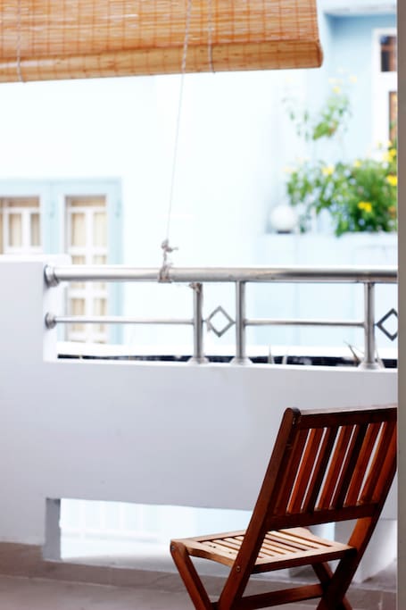 Nice balcony with plants and chairs
