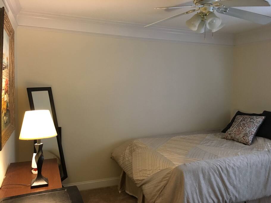 Private room with window, fan, dresser and mini fridge