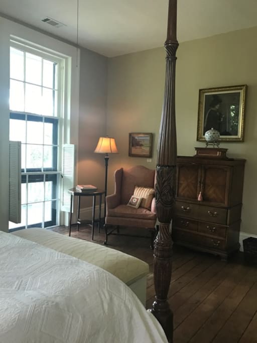 Bedroom corner with light for reading, TV, and access to upper Piazza