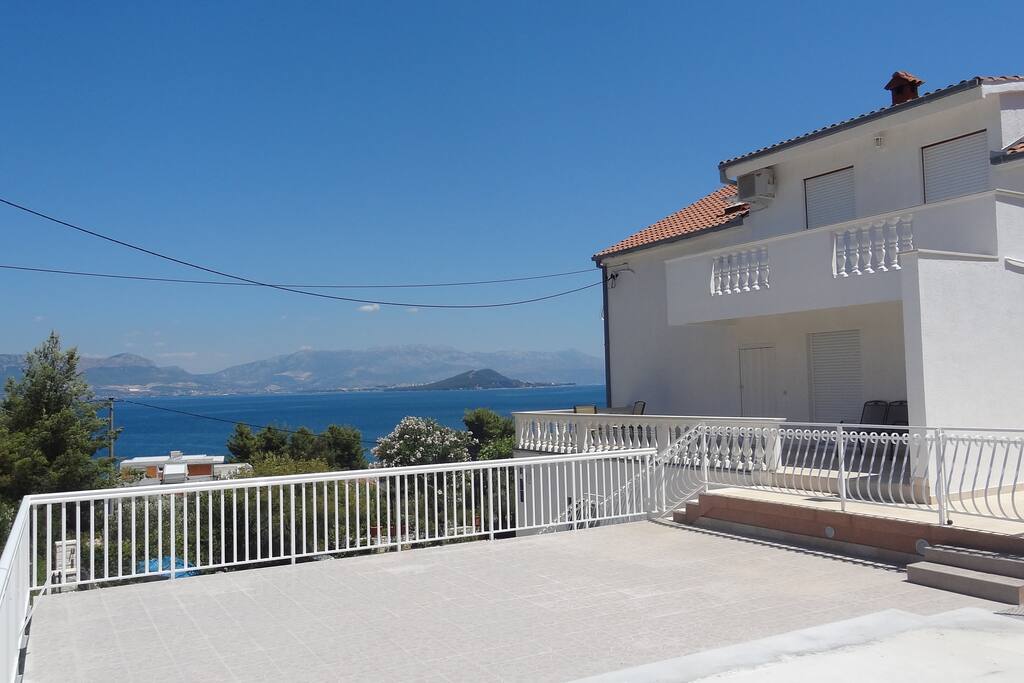 Sun deck and parking next to apartments