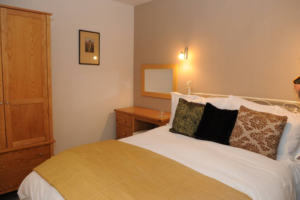 double bedded room with ensuite bathroom and garden views.
