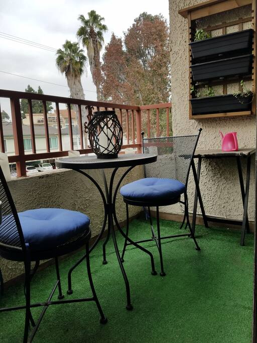 The private balcony with an herb garden and grill.