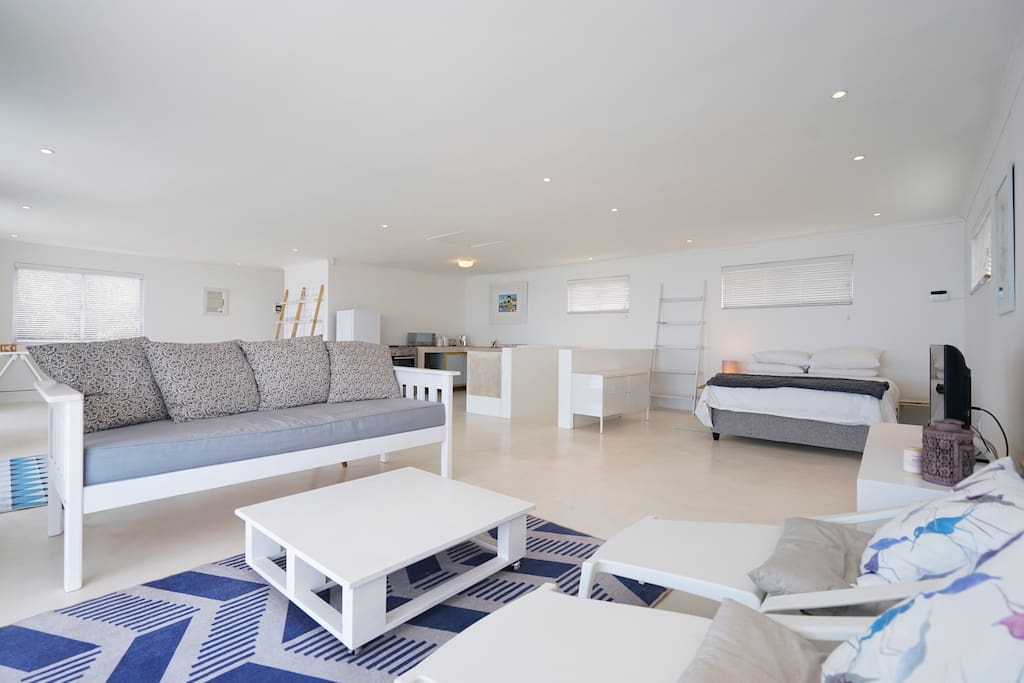 Clean, uncluttered furnishings in a light and airy open plan space.