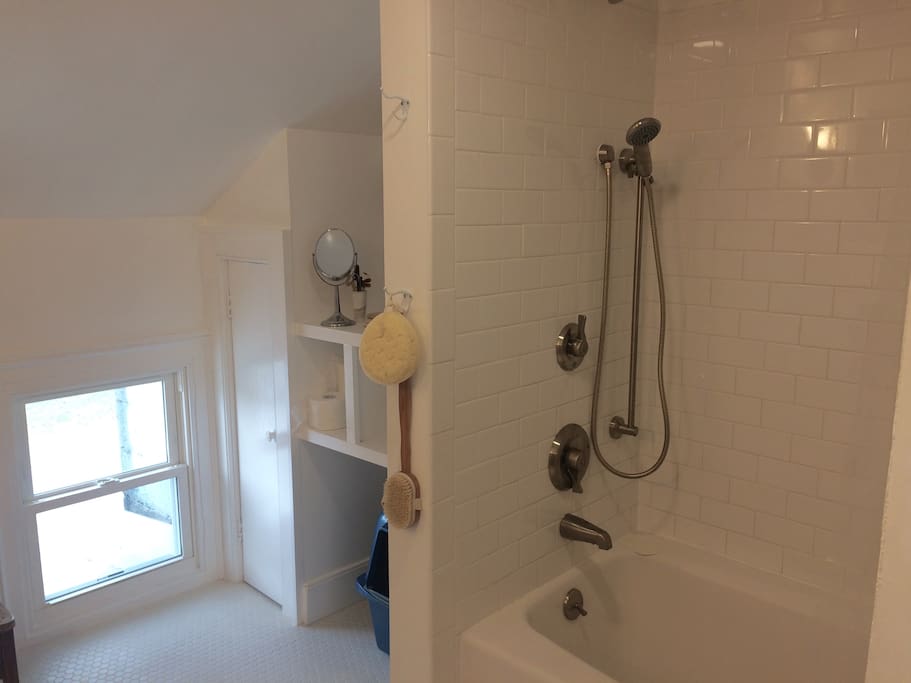 The newly renovated bath--spacious, pristine, all white and bright (much more so than in photo)