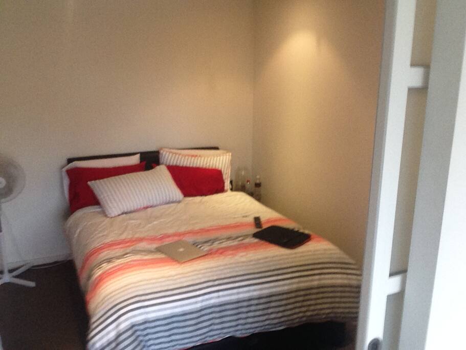 room with tv and wardrobe