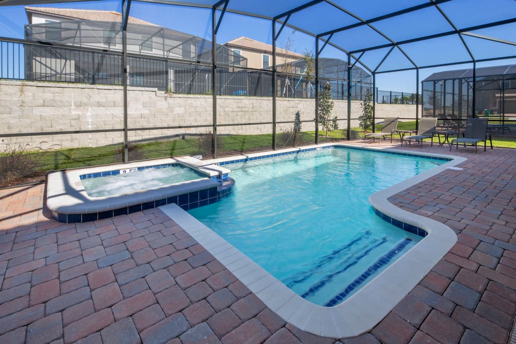 Make magical memories as a family when you stay in this beautiful ChampionsGate vacation home and play in and around this sparkling clear pool. The pool is fitted with a removable pool safety fence for your peace of mind.