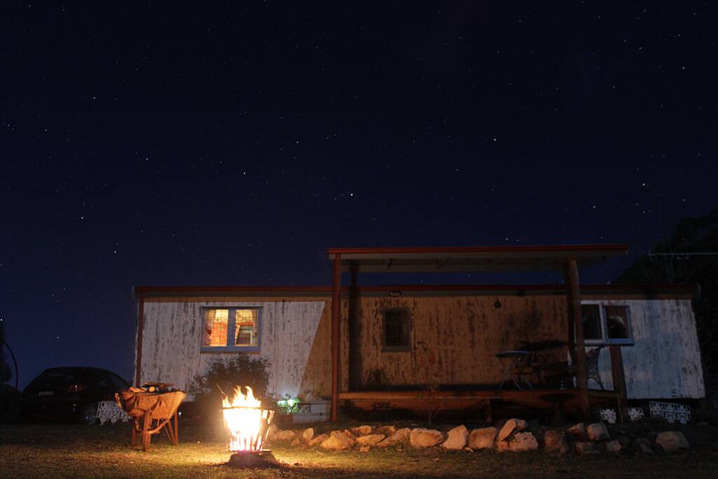 Wagon at night, fire, abundant stars
photo by guest Jonas Wolff