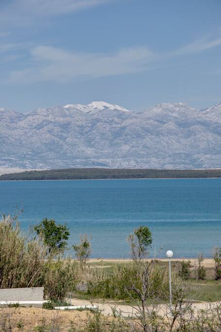 View: Queen’s Beach and Velebit Mountain.