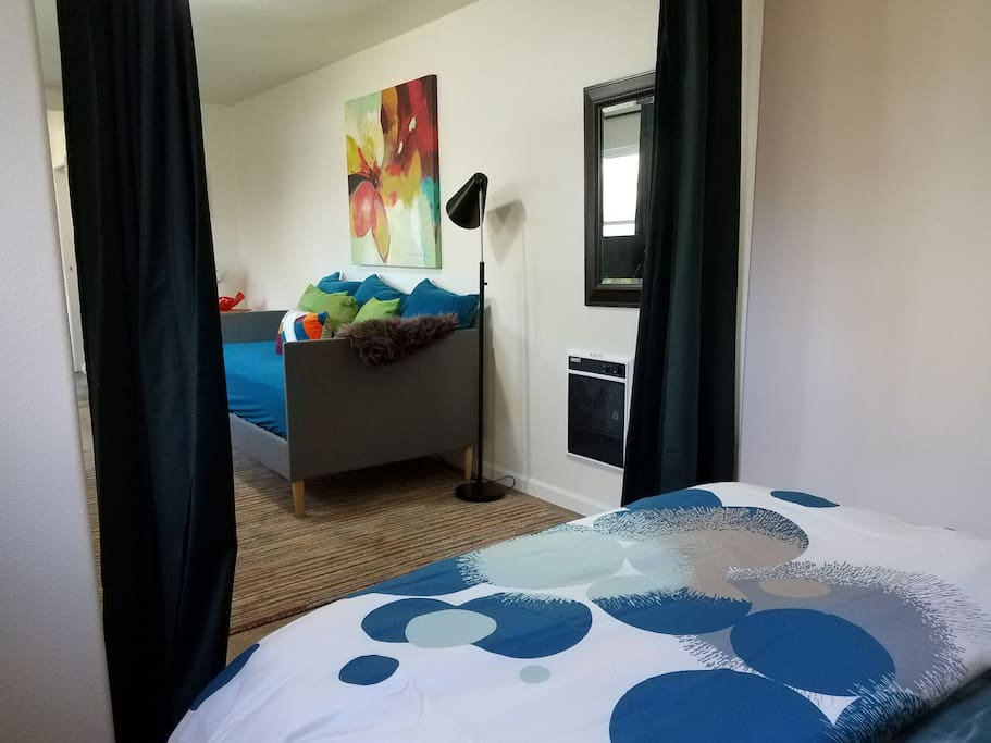 Bed area can be separated from the living area by drawing a heavy curtain