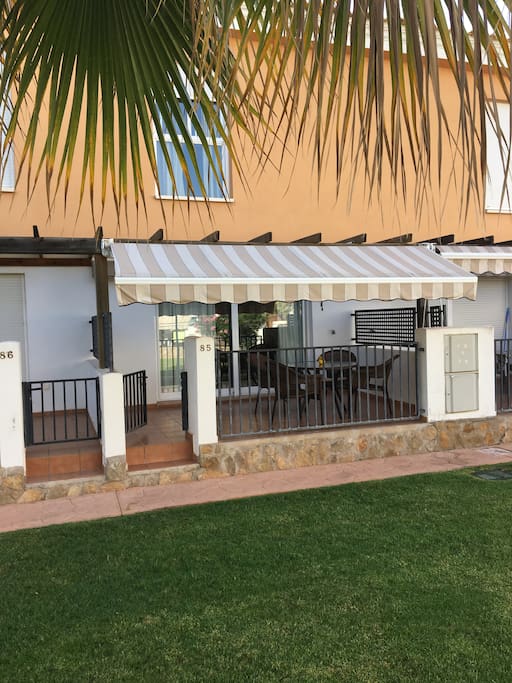 Rear terrace with full sun shade blind