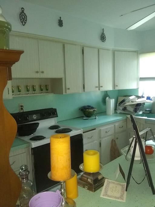 Kitchen use includes refrigerator, table, sink, microwave, and oven range
