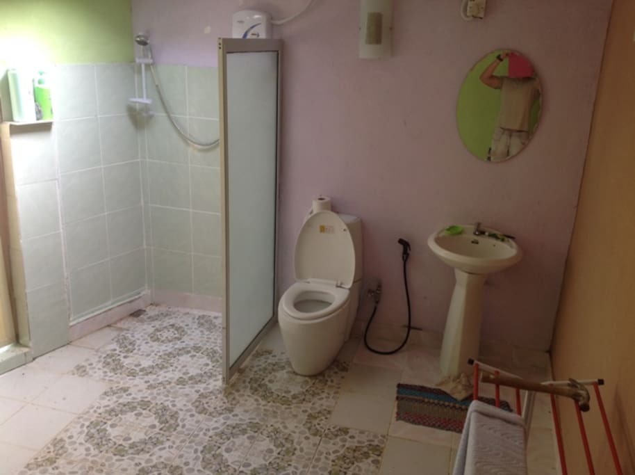spacious toilet with hot showers