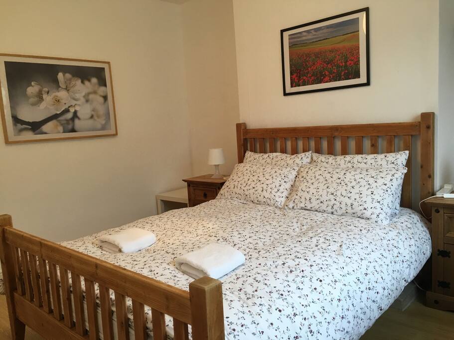 King size bed, super comfortable mattress, feather and down quilt and soft and firm pillows