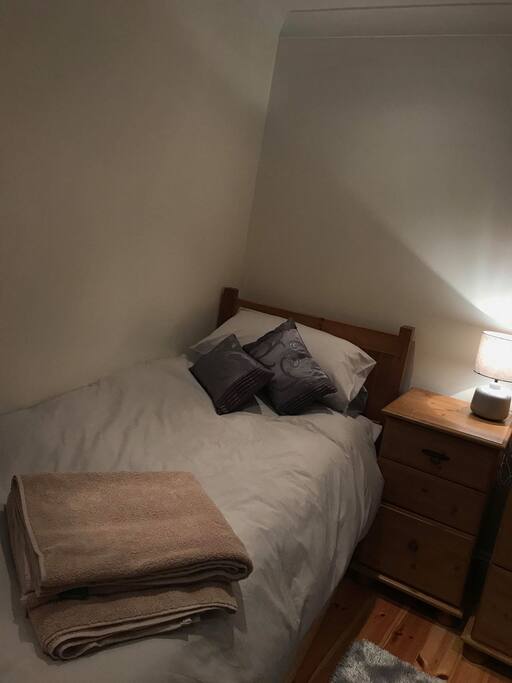 Full size single pull out mattress under neath single bed, with sturdy stands so is same level as single bed to create a comfy double if required.