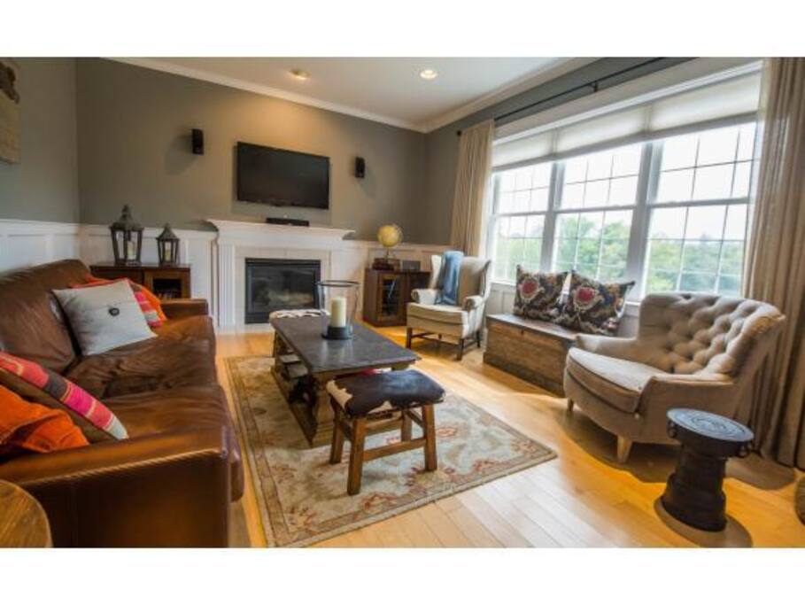Bright family room with high end furniture.