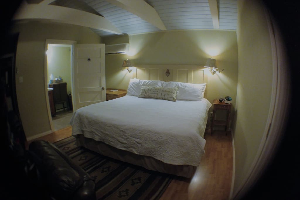 King Suite bed showing entrance to bath