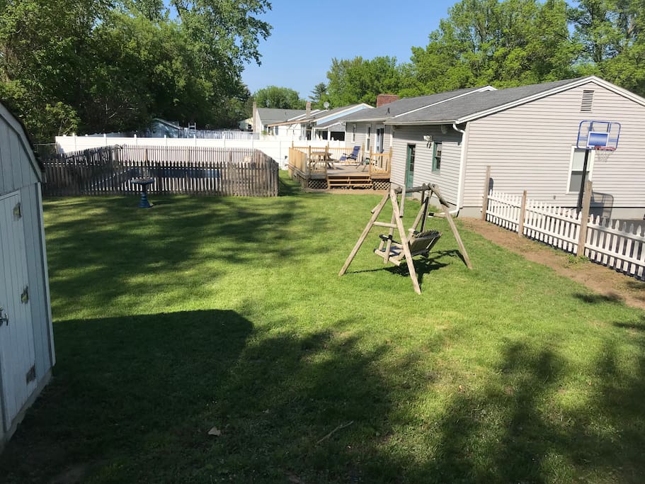 Back yard with new railing around deck. Two outside speakers with a stereo in the garage.