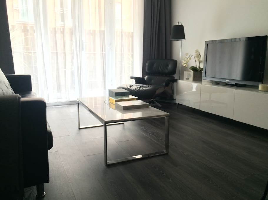 Daytime view of lounge with Eames ottoman.