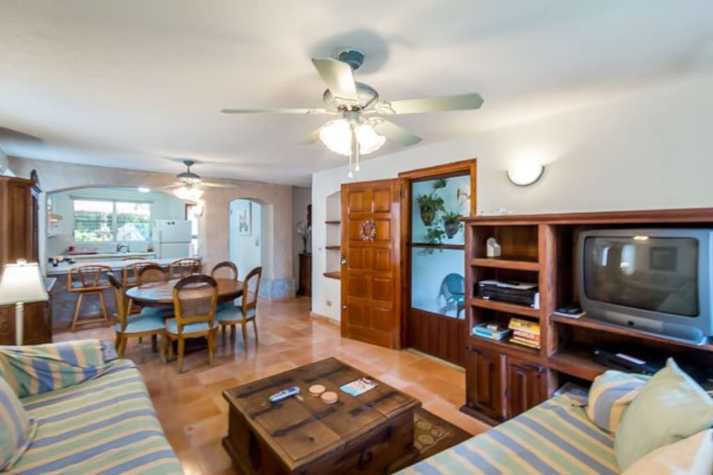The living room offers plenty of seating and homey touches