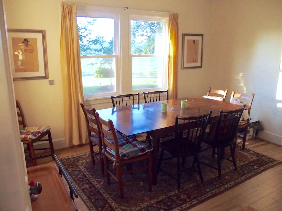 The dining room seats 8 comfortably and has a great view of the yard and hay field.