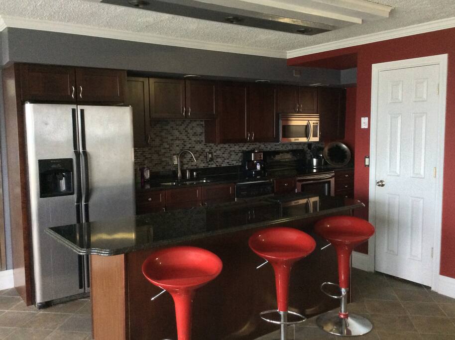 Kitchen, appliances, island with bar stools
