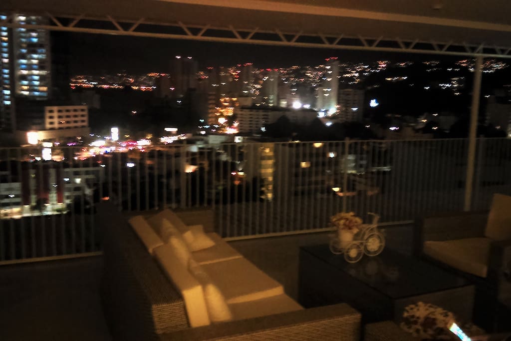 Your night view of the City and the Acapulco Bay.