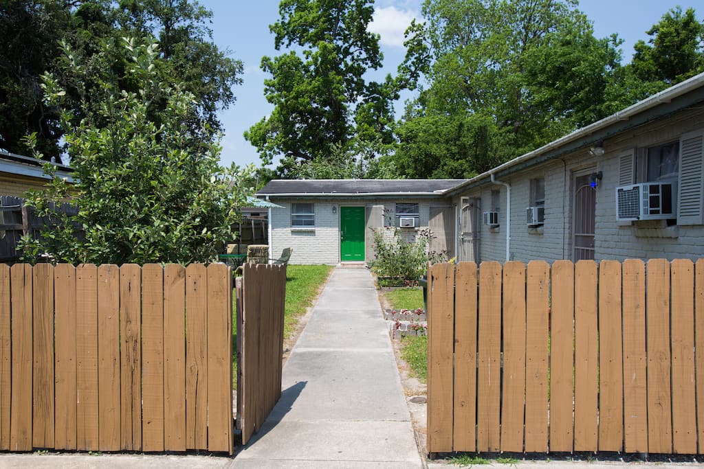 path to apartment w/ apple trees to the left.