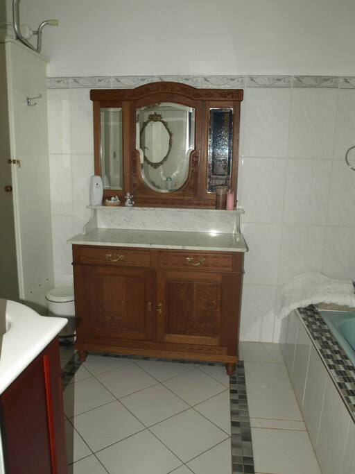 The en-suite bathroom with a bath/overhead shower.