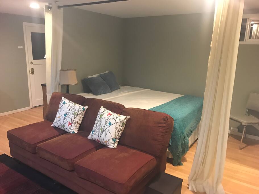 A view of the queen bed in the master with curtains open