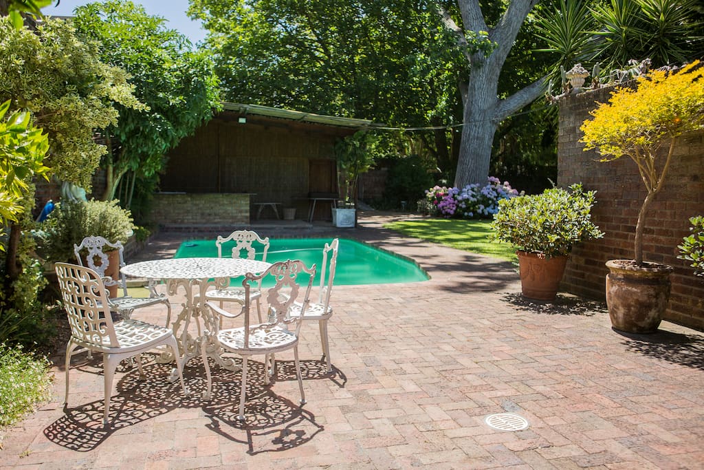 Sun tanning area by the pool looking onto our stunning garden.
