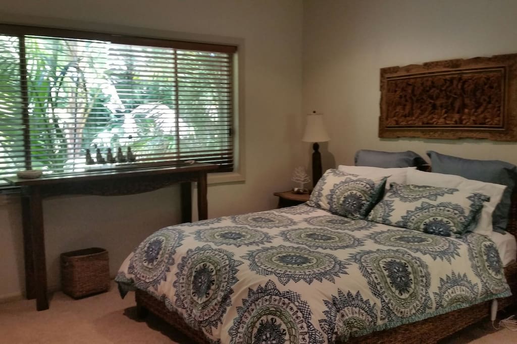 Main guest bedroom with tropical outlook.