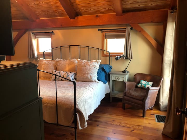 Master bedroom upstairs with tv and king bed 