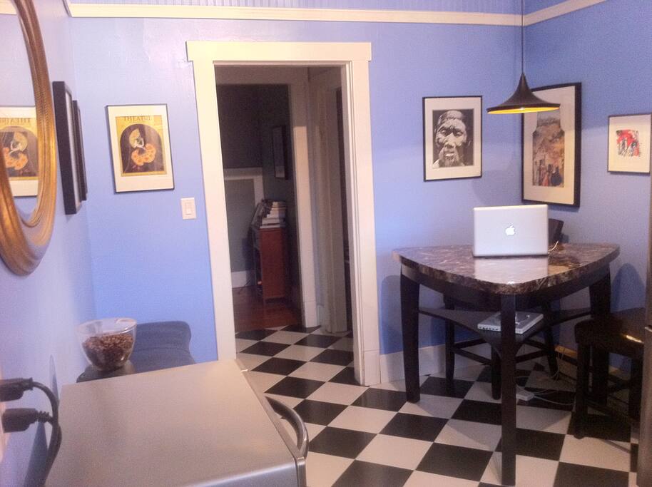 Classic tiled floors line the eating nook/workspace