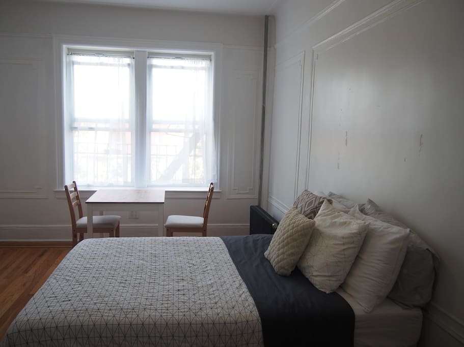 Well lit room with large windows and a breezy morning