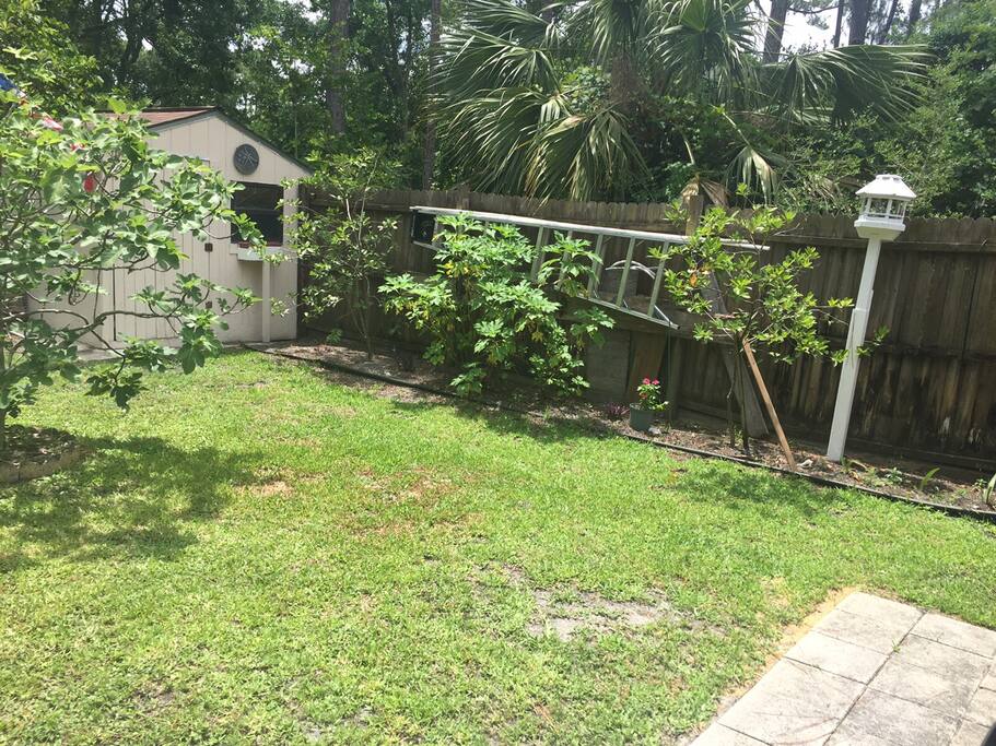 Backyard, has table and chairs, property is maintained daily.