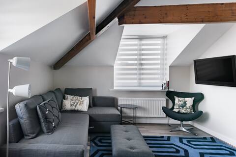 Take Breezy Beachfront Walks at a Chic Town Centre Abode