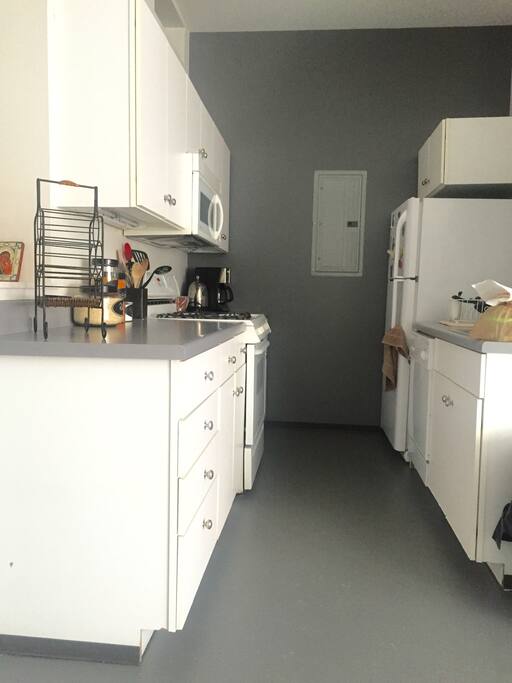 This is our kitchen, which includes all basic amenities. Our faucet is detachable and there is a sink disposal. The stove is gas (not electric). guests are welcome to use our coffee maker, blender, water boiler, plates, tupperware, pots/pans, and cutlery. We ask that you clean anything that you use. We have a dishwasher that would make this easy.