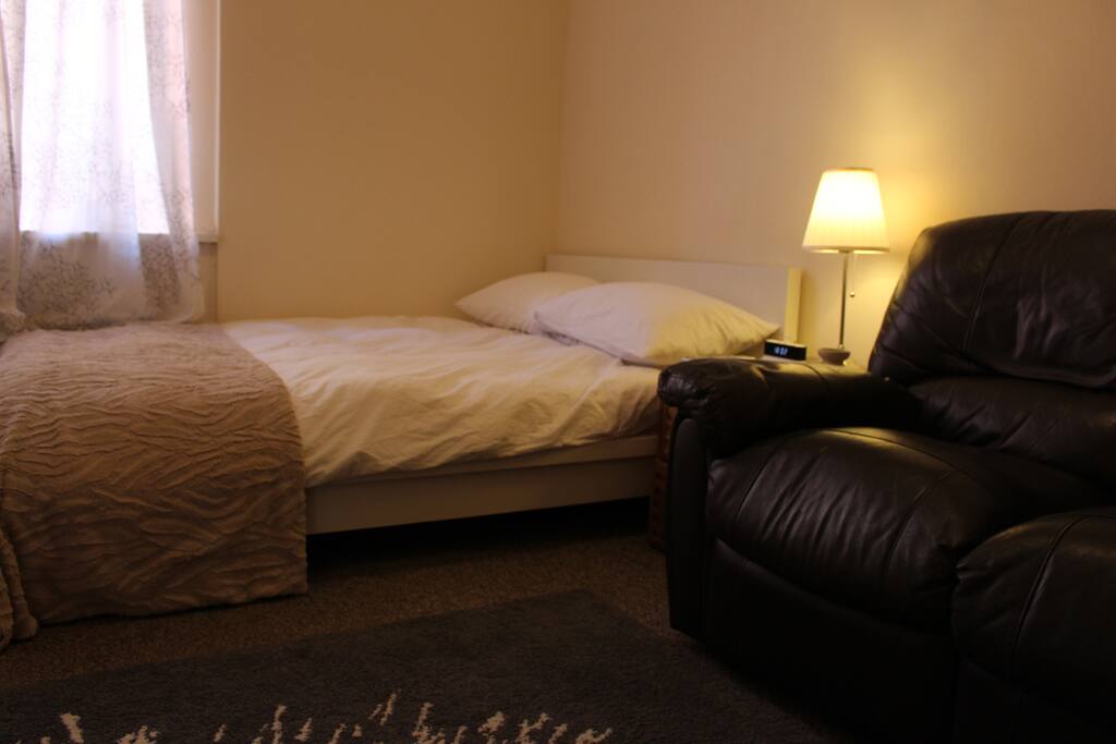 Back Bedroom with 3 Seater Black Leather Reclining Sofa
