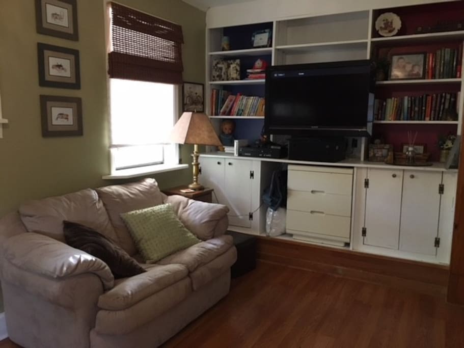 In bedroom - has TV, VCR, DVD player, books and a Wii as well as a makeup table available for guests.