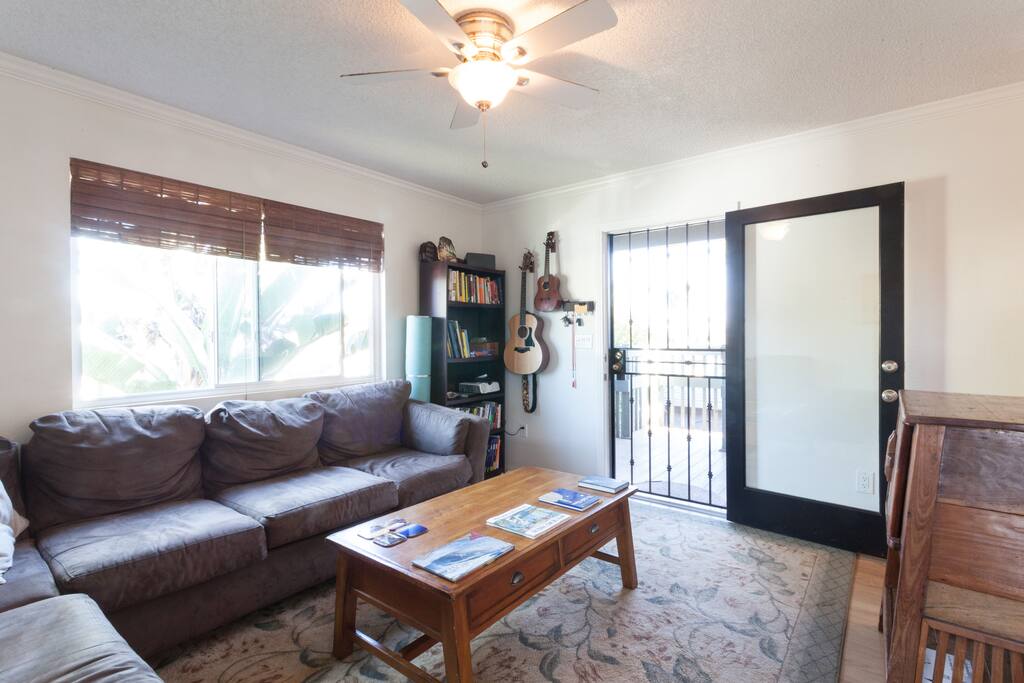 Living room. Enjoy lounging with our books and musical instruments.