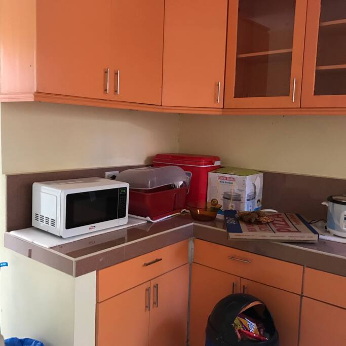 The kitchen with full drawers and cabinets. Next is a small extra room then the service area.
