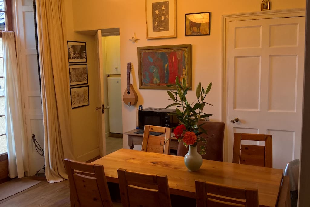 Dining area with microwave, toaster and easy access to fridge.