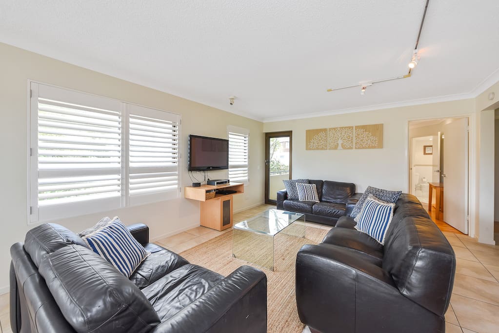 Living Area with TV and Plantation Shutters