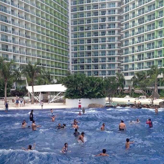 Guests swimming at the wave pool