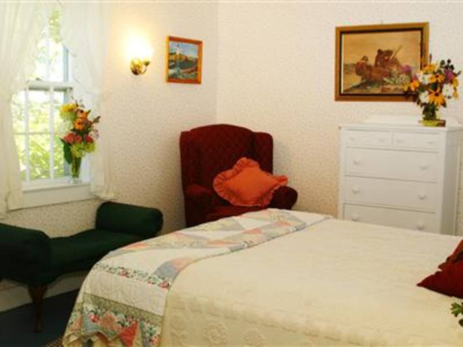 Room 6 in the 1860's Sea Captain's at Acadia's Oceanside Meadows Inn. This room has windows facing both north and east looking over the meadows and gardens and enjoys the sound of the surf on our private sand beach. Offering a queen sized bed and en-suite private bathroom with large corner shower.