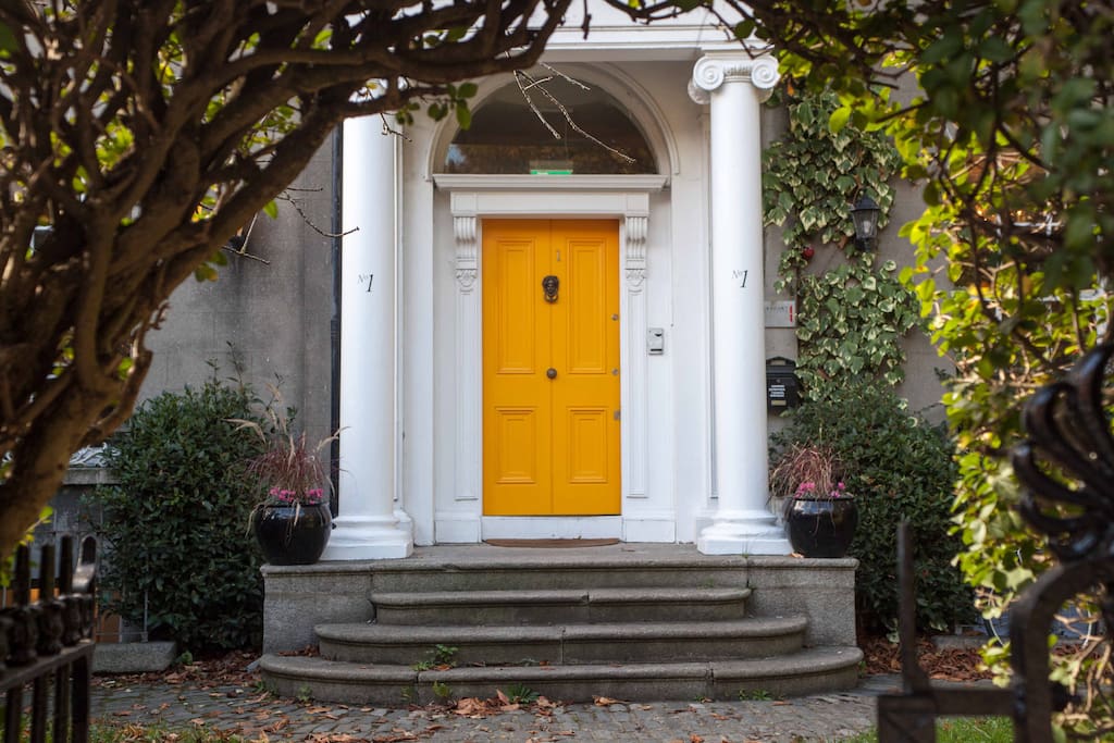 Our yellow door. Our building dates from 1830. It is the only regency period terrace remaining in Ireland.
