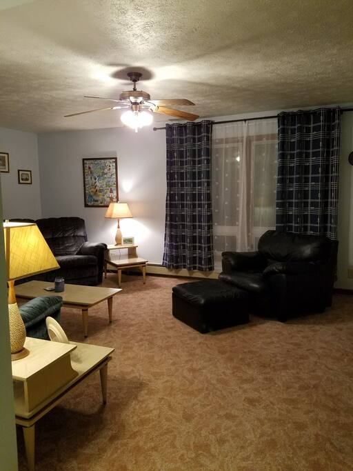 Spacious and light, the living room is a beautiful gathering space. Possibly an extra space for sleeping guests too.
