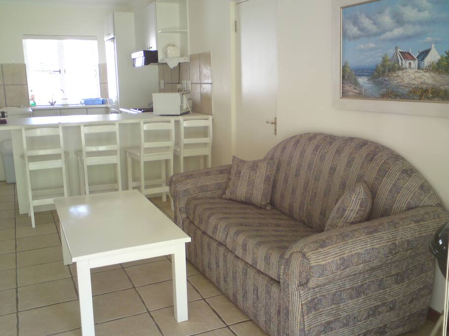 Open plan living space includes fully fitted kitchen