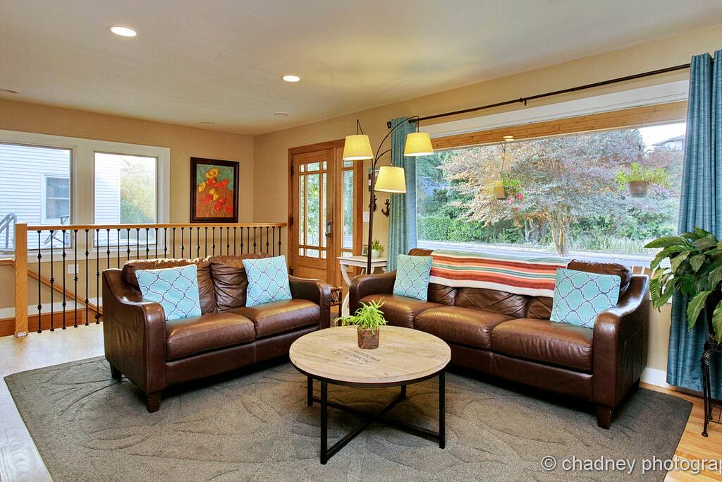 Main level living room with stairs to guest area