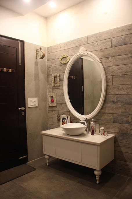 This is the attached bathroom with access to a dressing area.